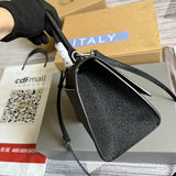 Front view of classic signature women's handbag – women's designer-style accessory