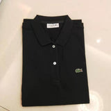 Flat lay presentation of Lacoste luxury clothing with signature branding