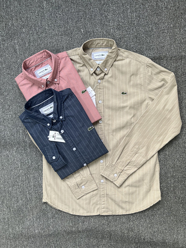 Flat lay presentation of Lacoste luxury clothing with monogram-inspired silhouette