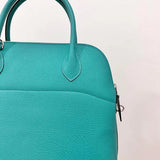 Side view of sleek structured handbag