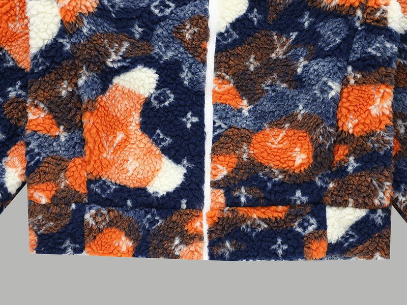 Flat lay presentation of Louis Vuitton luxury clothing with monogram-inspired silhouette