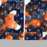 Flat lay presentation of Louis Vuitton luxury clothing with monogram-inspired silhouette