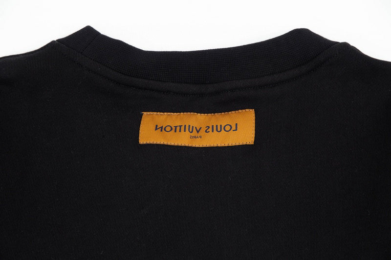 Close-up detail shot of Louis Vuitton luxury clothing with relaxed-fit cut