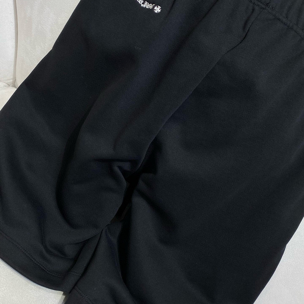 Side profile of Chrome Hearts Shorts showcasing structured silhouette