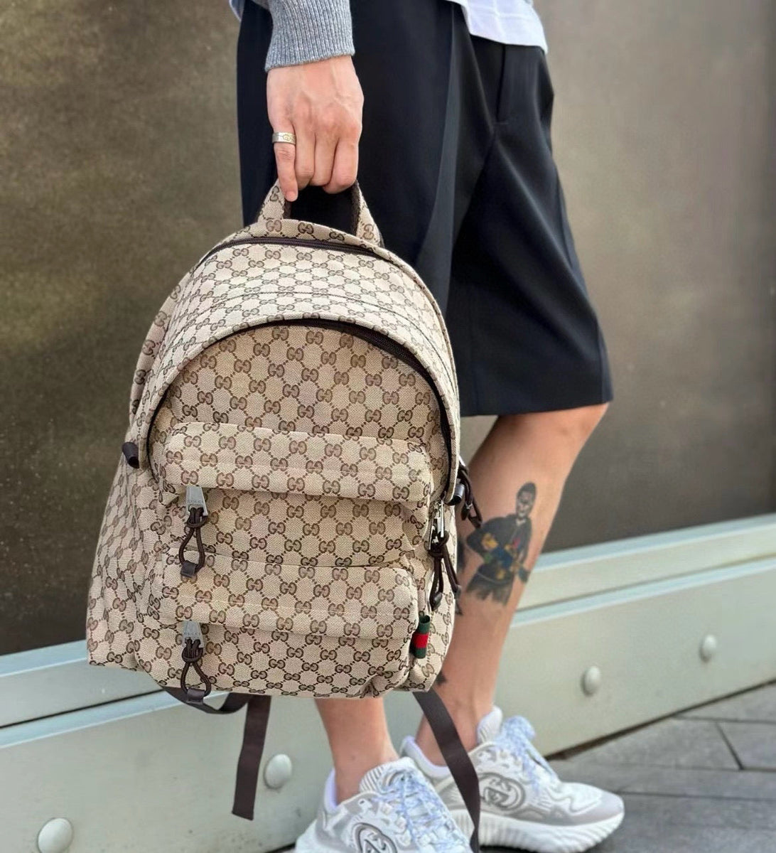 Gucci Backpack flat lay on neutral background