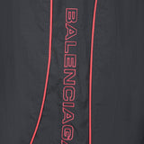 Close-up of Balenciaga bermudas hardware and fine stitching