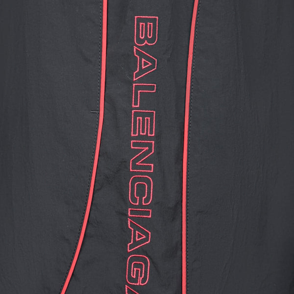 Close-up of Balenciaga bermudas hardware and fine stitching