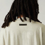 Front view of Fear of God Essentials Long T-shirt premium t-shirt
