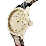 Side view of Burberry women's gold watch