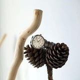 Close-up detail view of Burberry women's gold watch