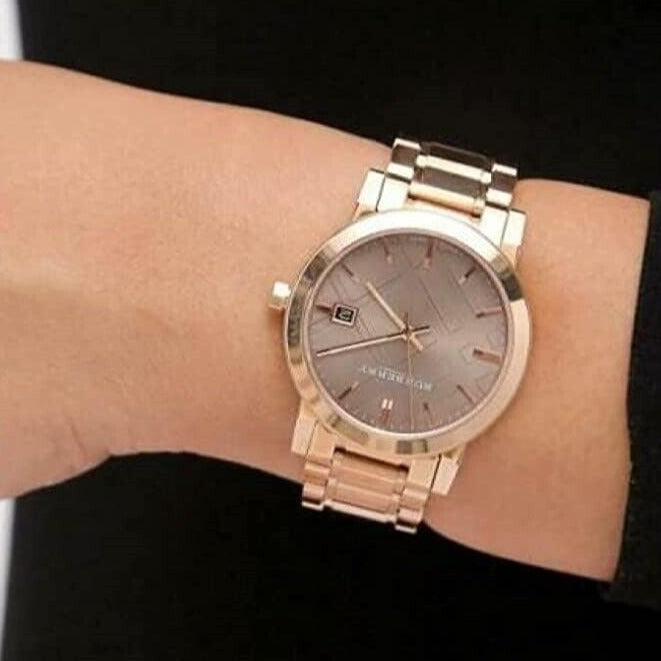 Side view of Burberry women's rose gold watch