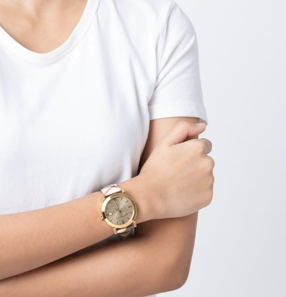 Lifestyle view of Burberry women's gold watch