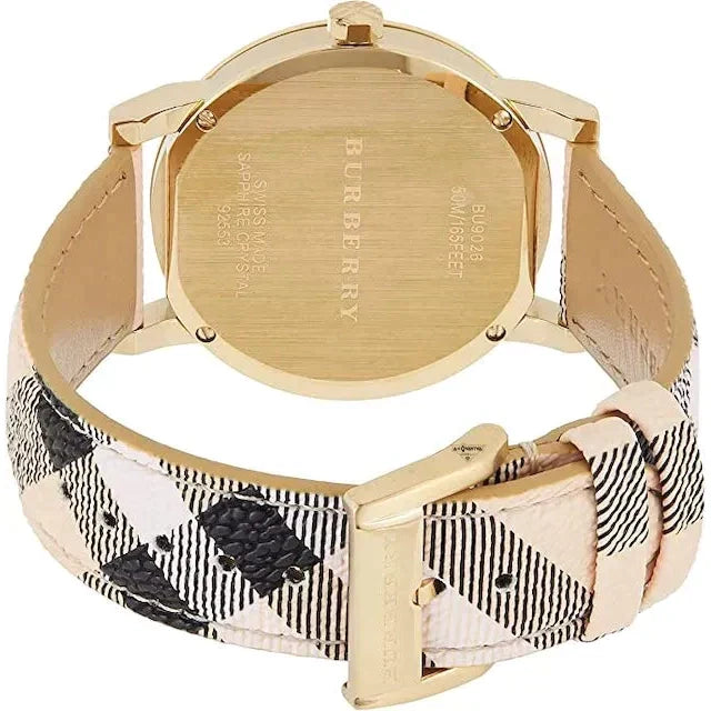 Side view of Burberry women's gold watch