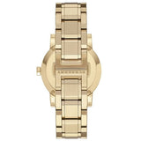 Lifestyle view of Burberry women's gold watch