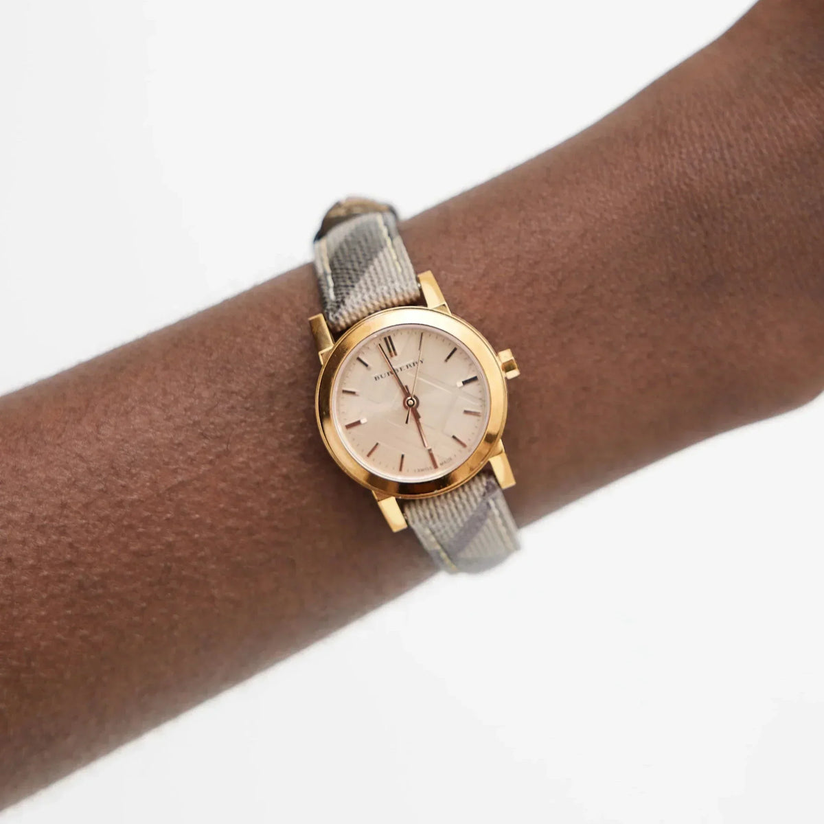 Side view of Burberry women's rose gold watch