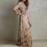 Woman wearing a floral dress against a neutral background