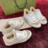 Gucci Sneakers – luxury designer piece with signature house detailing