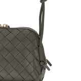 Close-up of Bottega Veneta clutches hardware and fine stitching