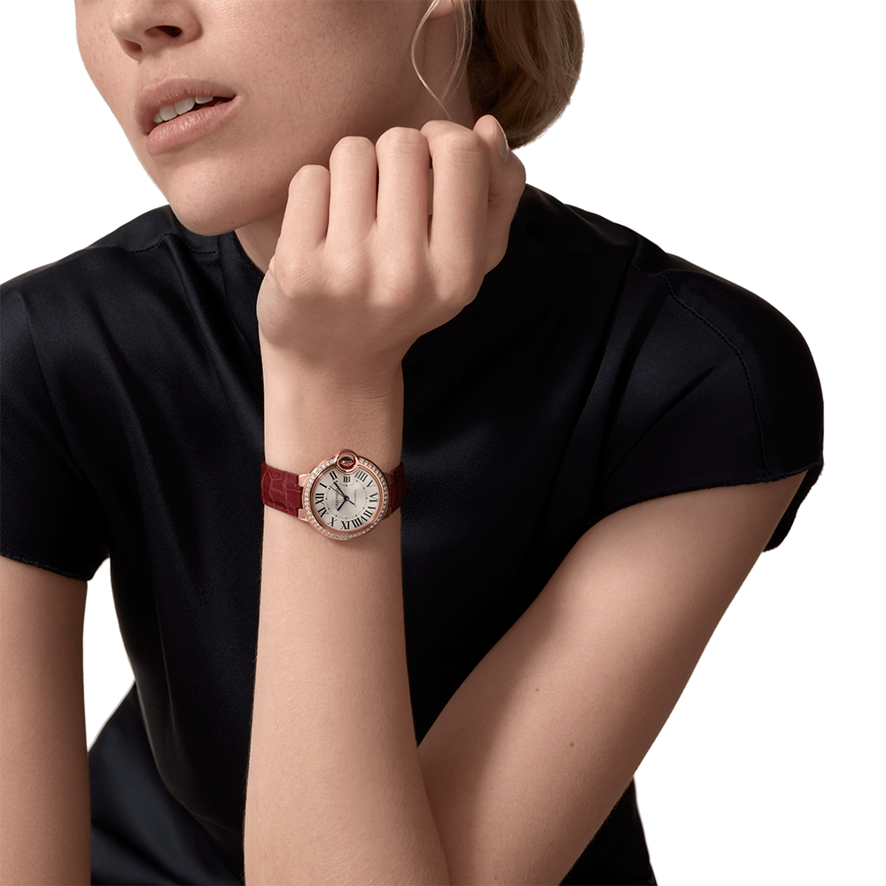 Close-up detail view of Cartier unisex rose gold watch