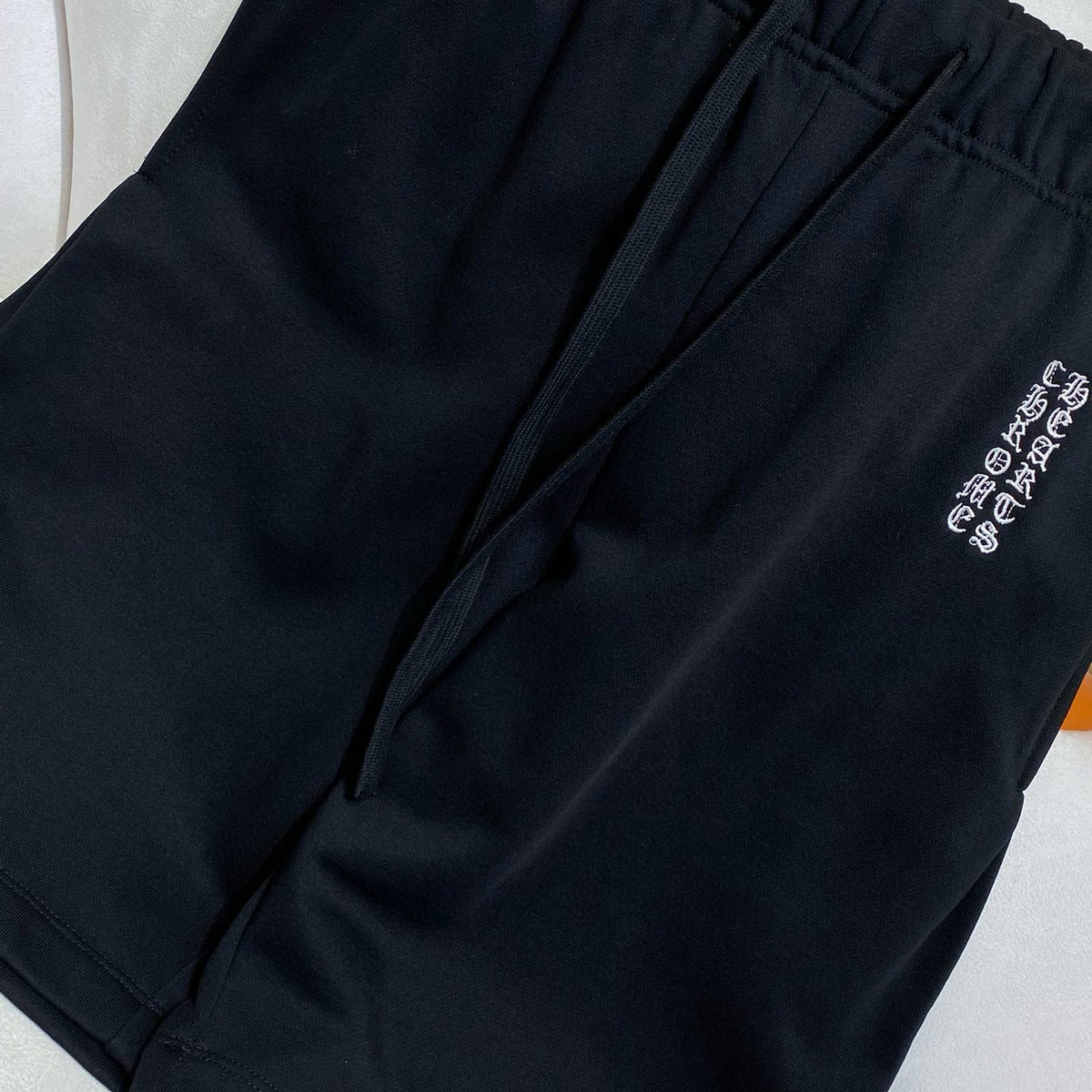 Close-up of Chrome Hearts Shorts signature hardware and stitching detail