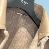 Close-up of Fendi Coat signature hardware and stitching detail