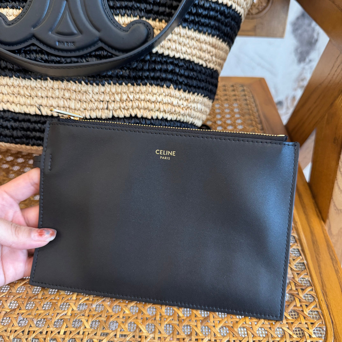 Celine Handbag flat lay on neutral background