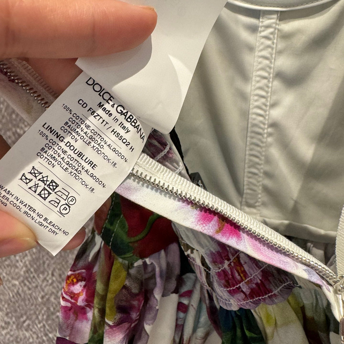 Close-up of Dolce & Gabbana Dress signature hardware and stitching detail