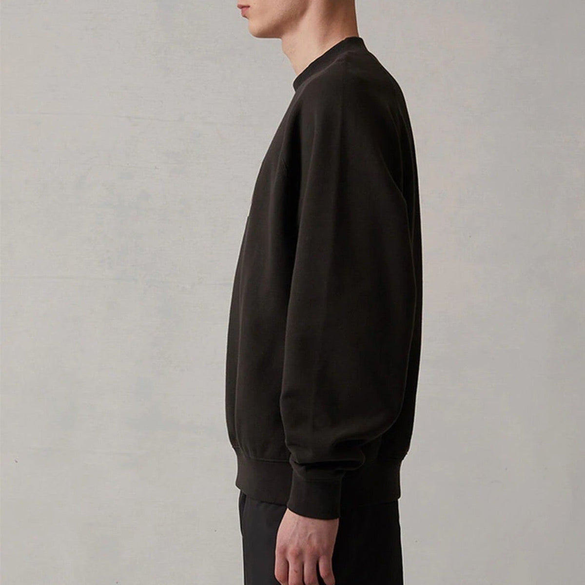 Front view of Fear of God Essentials premium Sweatshirt with iconic logo hardware