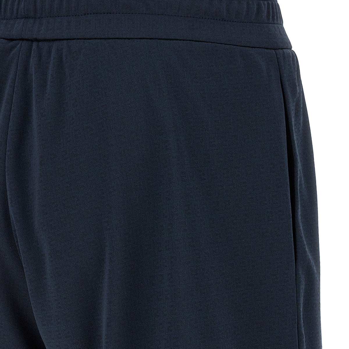 Close-up of Fendi pants hardware and fine stitching