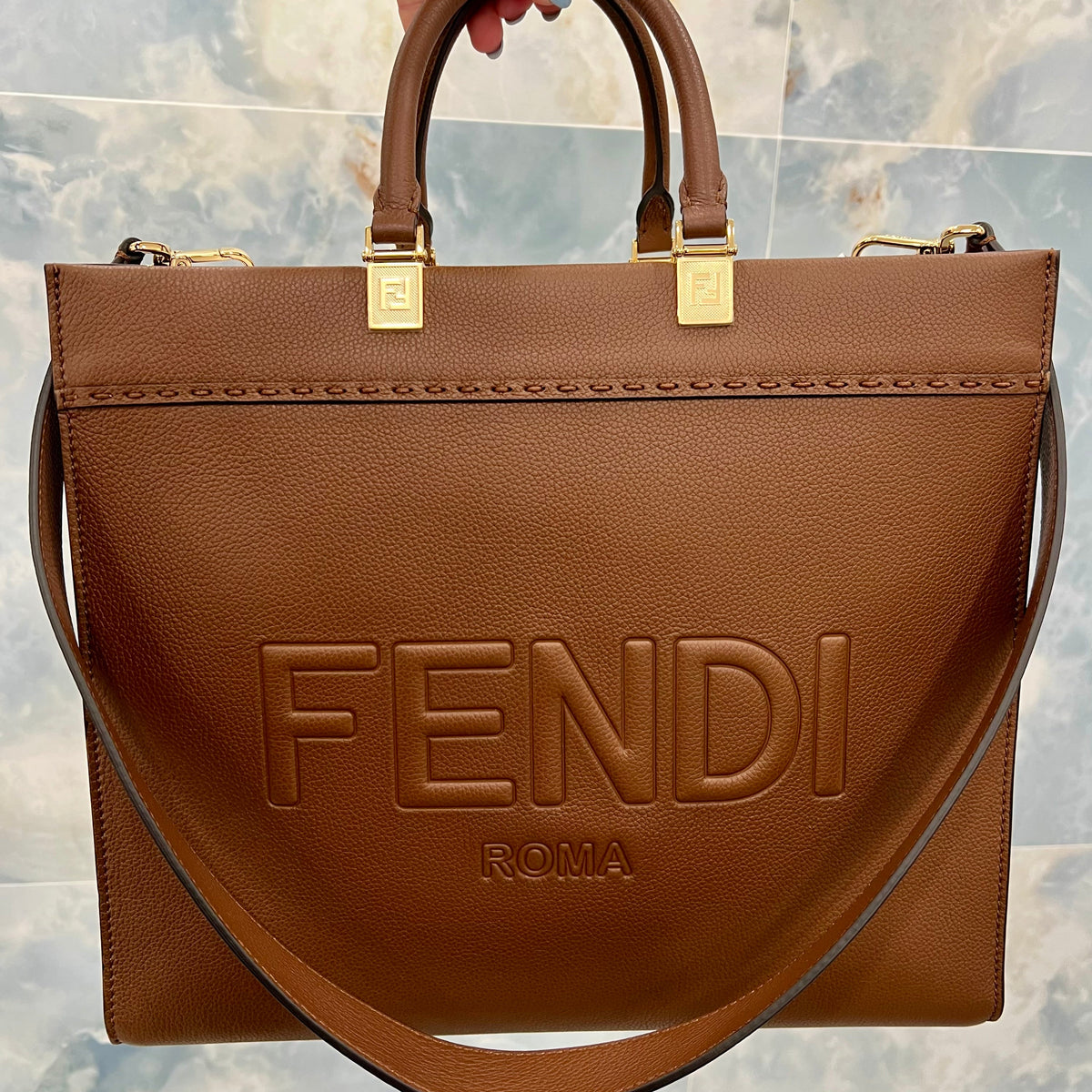 Close-up of Fendi tote bags hardware and fine stitching