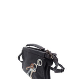 Close-up of Peekaboo bags hardware and fine stitching