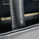 Close-up of Petite bags hardware and fine stitching