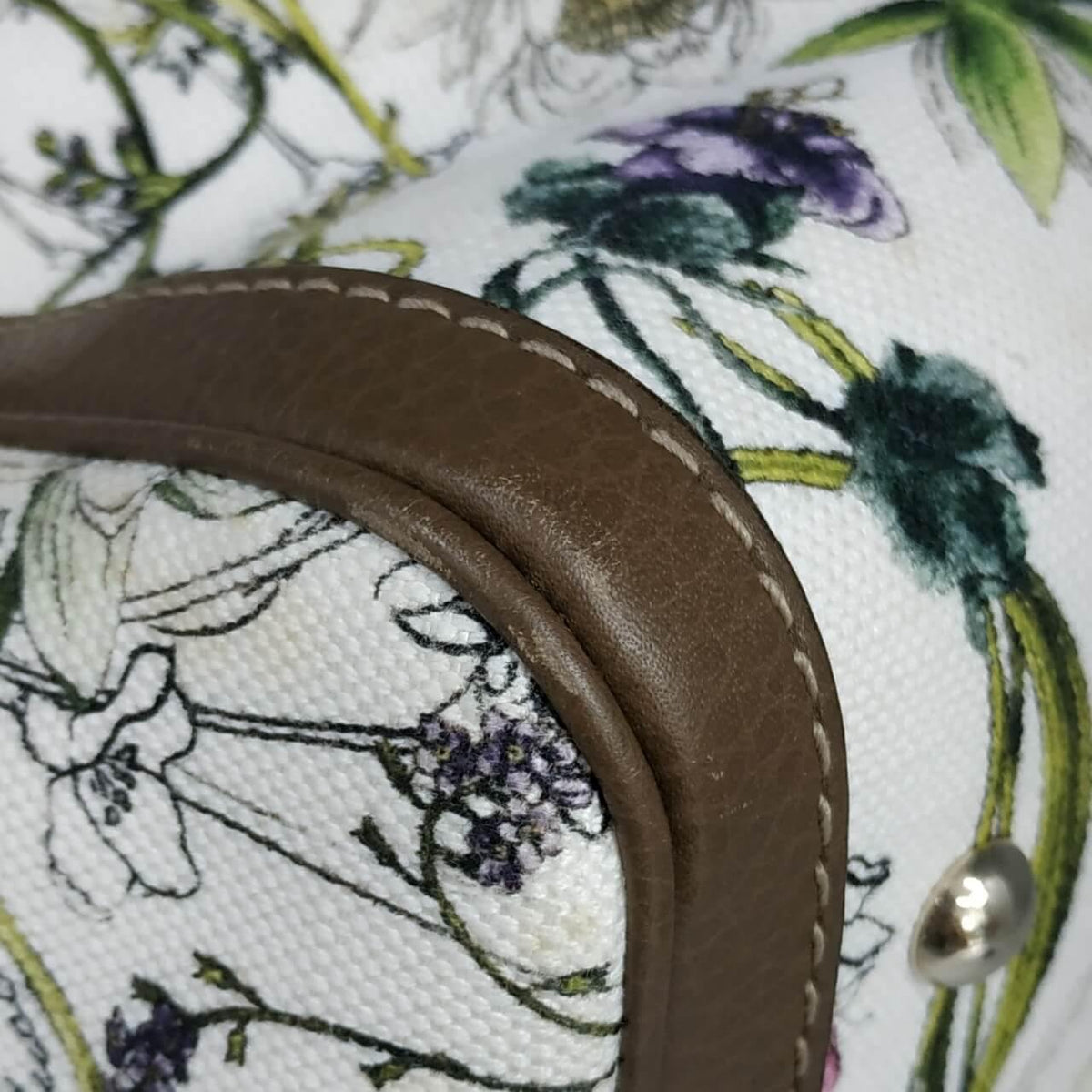 Close-up of Floral bags hardware and fine stitching