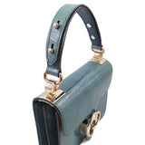 Close-up of Lizard bags hardware and fine stitching