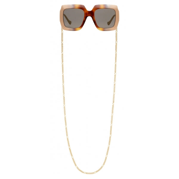 Close-up of Gucci sunglasses hardware and fine stitching