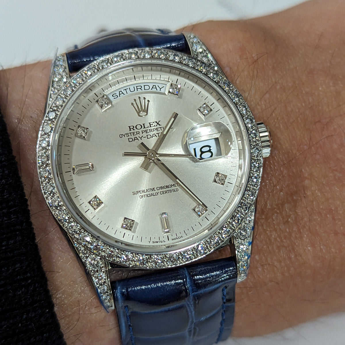 Side view of Rolex unisex gold watch