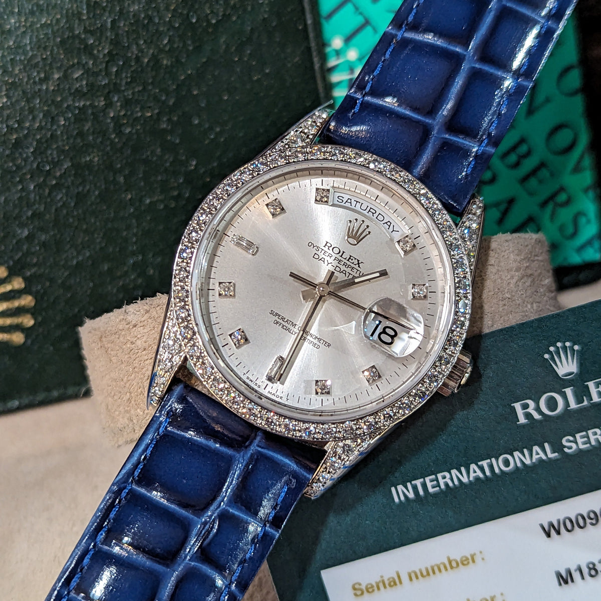 Close-up detail view of Rolex unisex gold watch
