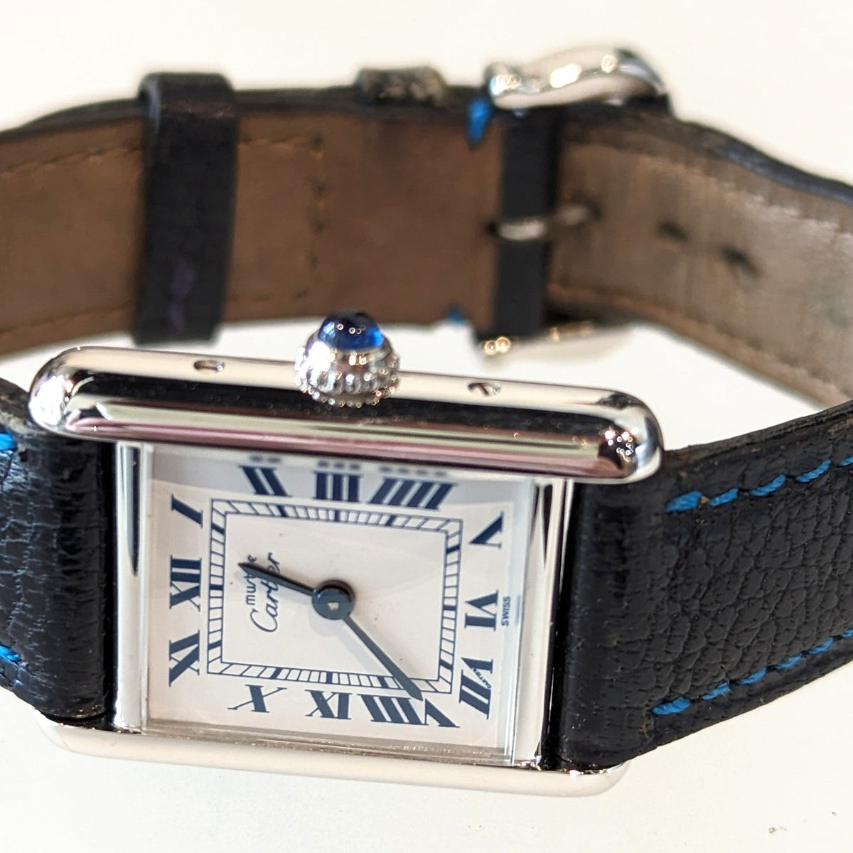 Close-up detail view of Cartier unisex silver watch