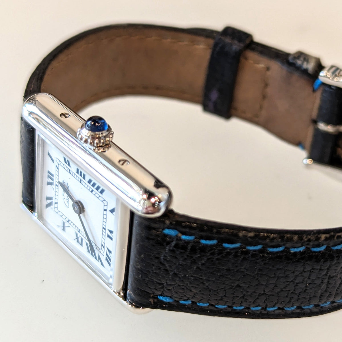 Side view of Cartier unisex silver watch
