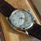 Side view of Rolex unisex gold watch