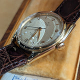 Close-up detail view of Rolex unisex gold watch