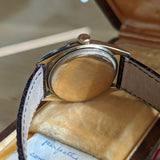 Side view of Rolex unisex gold watch