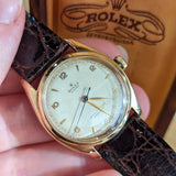 Front view of Rolex unisex gold watch