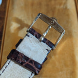 Angled view of Rolex unisex gold watch