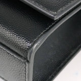 Close-up of Monogram bags hardware and fine stitching