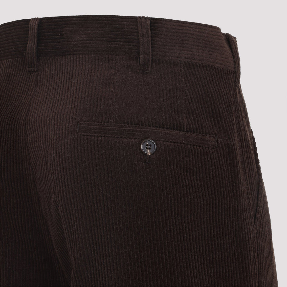 Close-up of Prada pants hardware and fine stitching