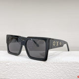 Close-up detail view of Louis Vuitton unisex sunglasses