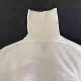 Close-up detail shot of Louis Vuitton luxury clothing with everyday silhouette