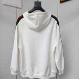 Side profile of Gucci luxury clothing with label-forward styling