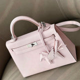  clean-lined shoulder bag styled with outfit